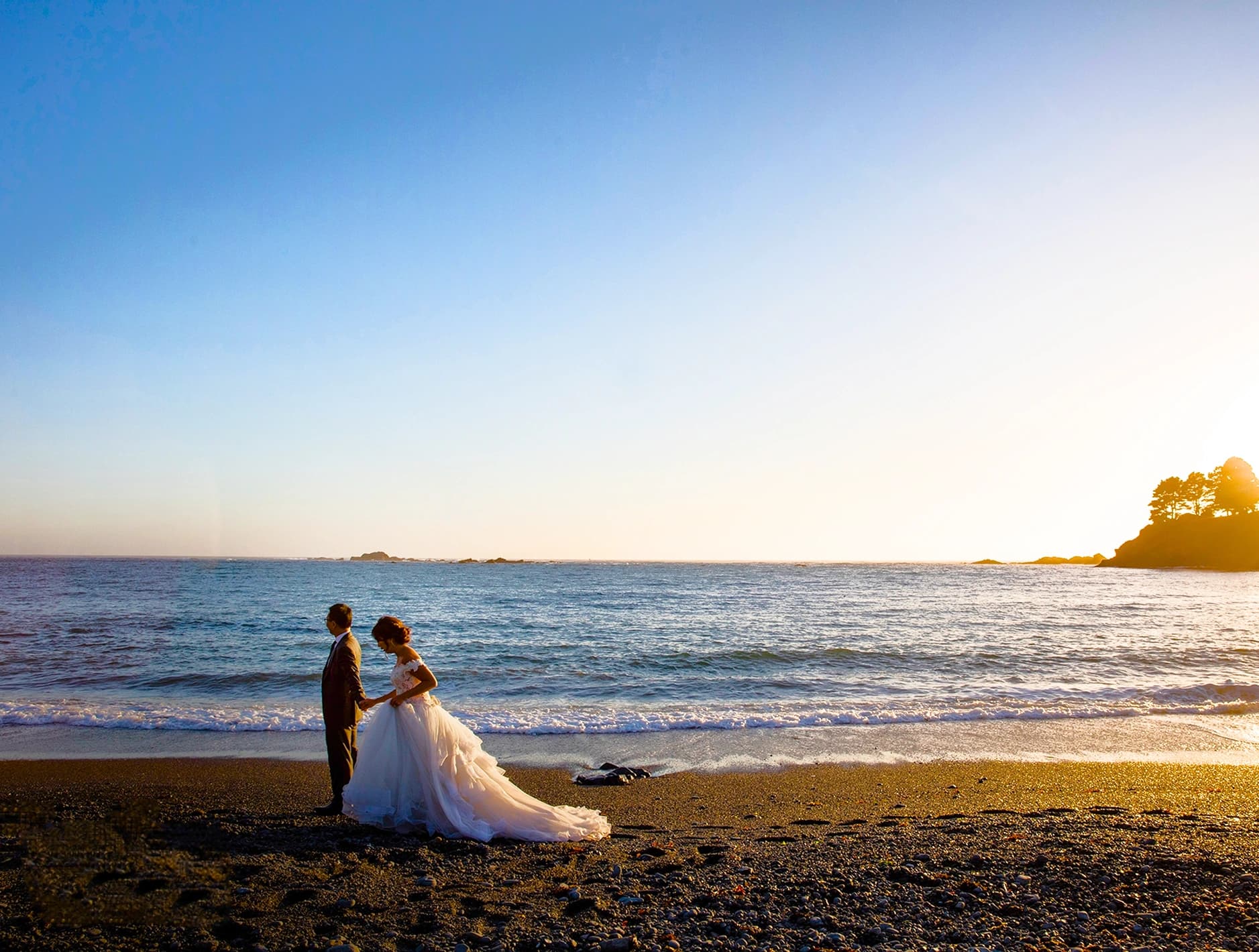 Wedding FAQ — couple on the beach at sunset Wedding FAQ — couple on the beach at sunset